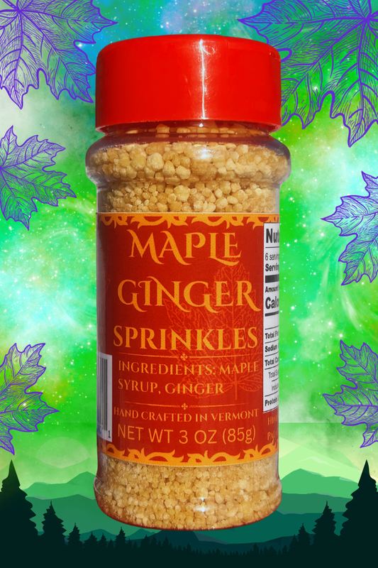 A bottle of Maple Ginger Sprinkles with a red cap, labeled with the product name and weight, against a background with green elements and a silhouette of a forest.